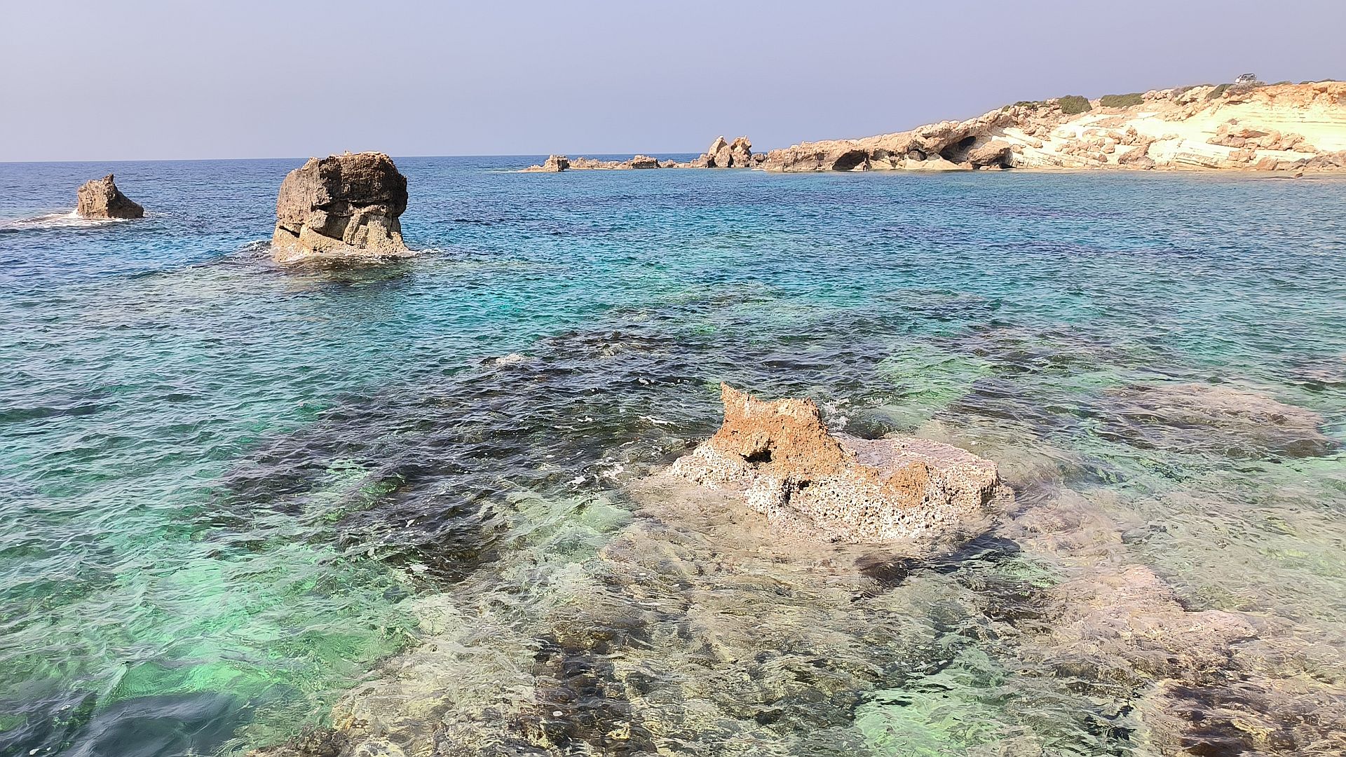 Rocky Cyprus coastline with clear turquoise water